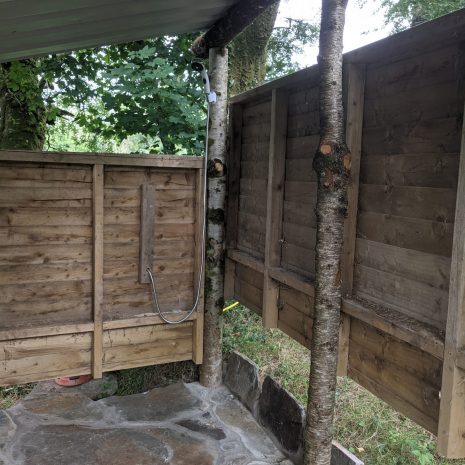 outside hot shower at wild camping campsite in Wales