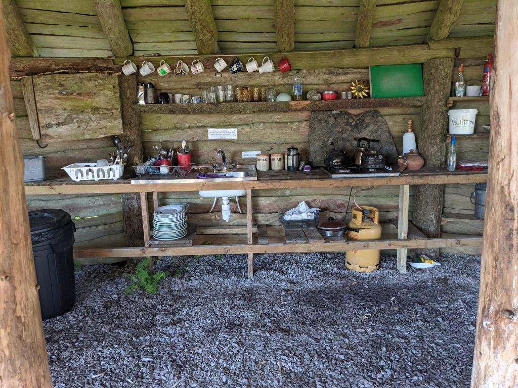 communal kitchen area at temple druid campsite wales