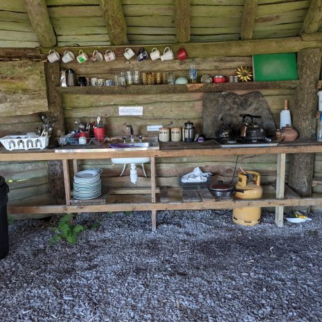 communal kitchen area at temple druid campsite in wales